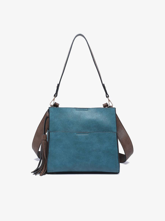 Blue handbag with brown strap and tassel on a white background