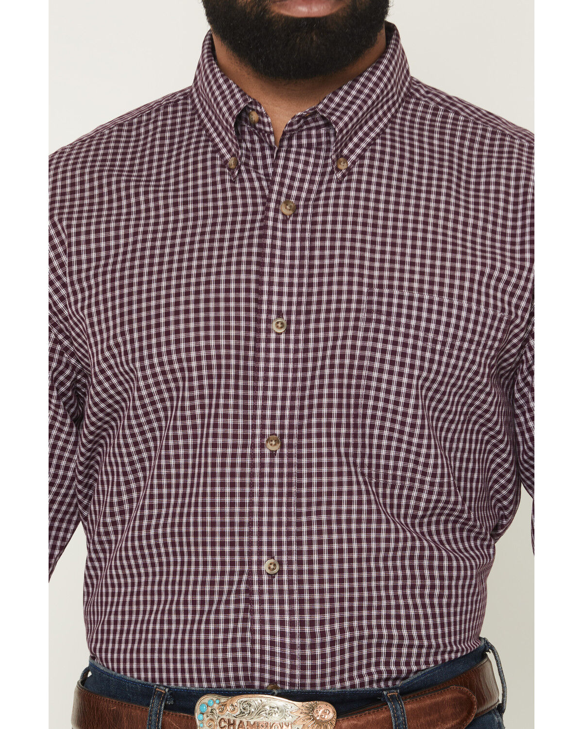 Men's long sleeve burgundy plaid button-down shirt with collar and front pocket