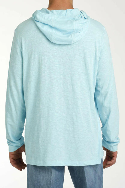Light blue hoodie worn by a person on a white background