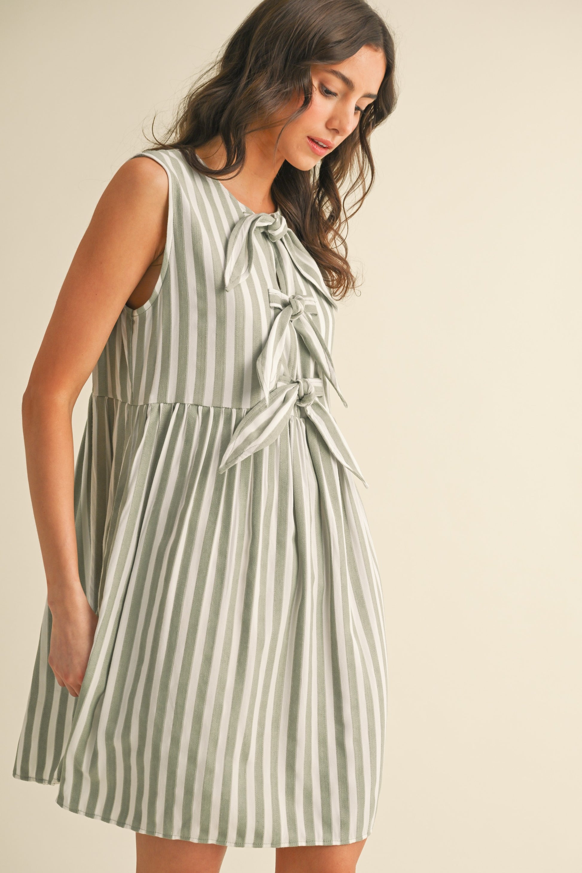 Sage Vertical Striped Front Bow Detail Mini Dress SACS Supply & Outfitters Sage Vertical Striped Front Bow Detail Mini Dress SACS Supply & Outfitters