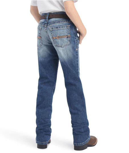 Person wearing blue jeans on a white background