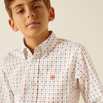 Boy in a white button-up shirt with red and blue geometric print and front pocket