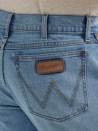 Close-up of Wrangler blue denim jeans back pocket with stitched logo patch
