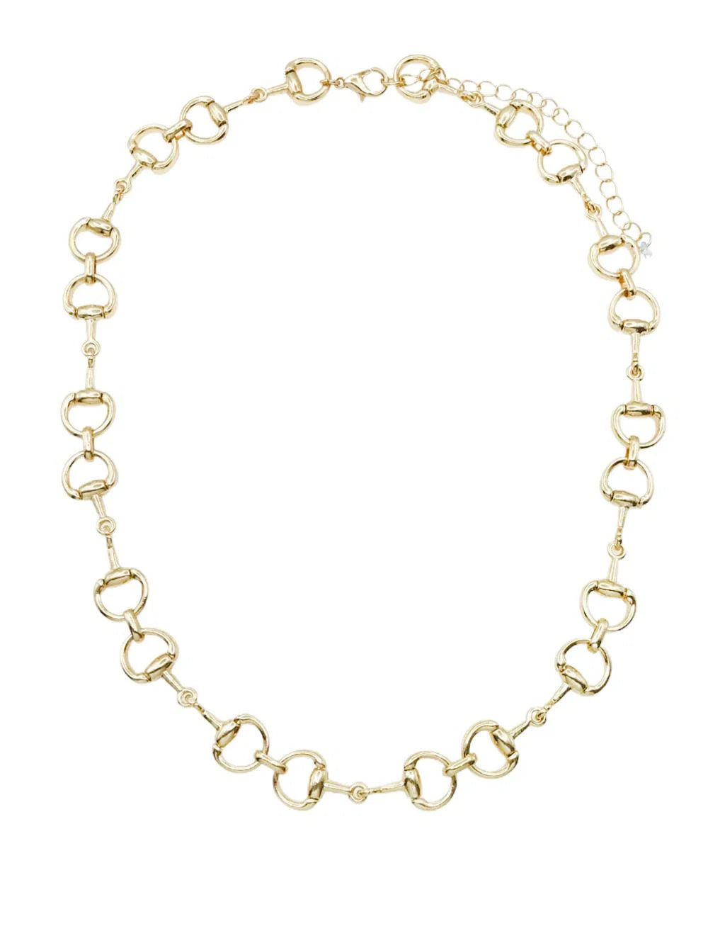 A gold-tone horsebit chain necklace with a delicate extender chain, displayed on a clean white background.