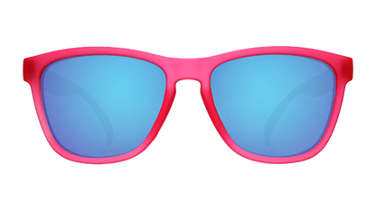 Sunglasses with pink frame and blue lenses on a white background