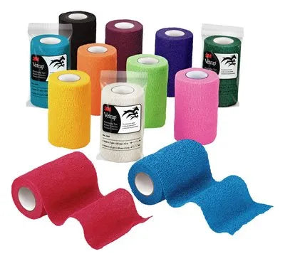 Assorted colorful bandages on a white background