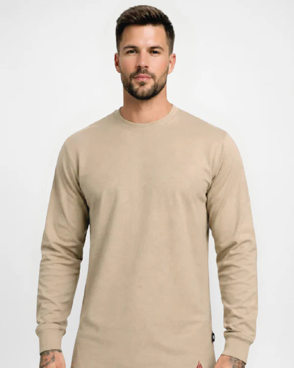 Man wearing a beige long-sleeve shirt against a white background