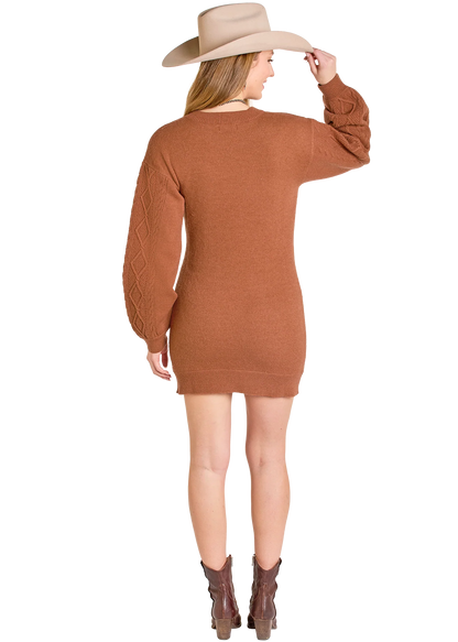 Woman wearing brown knit sweater dress, cowboy hat, and boots, back view