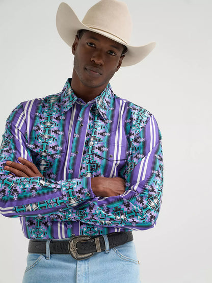 Man in cowboy hat wearing purple and turquoise patterned western shirt and belt