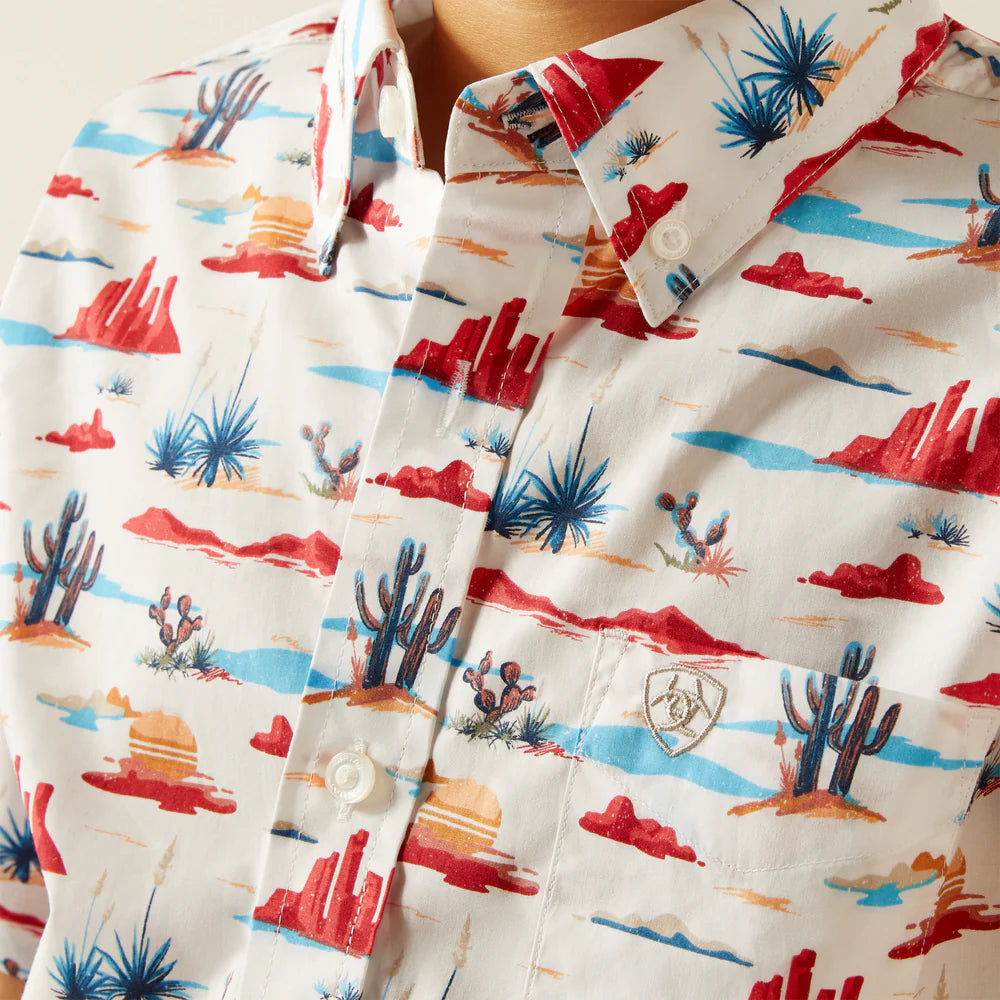 Men’s button-up shirt with colorful desert landscape and cactus print pattern.