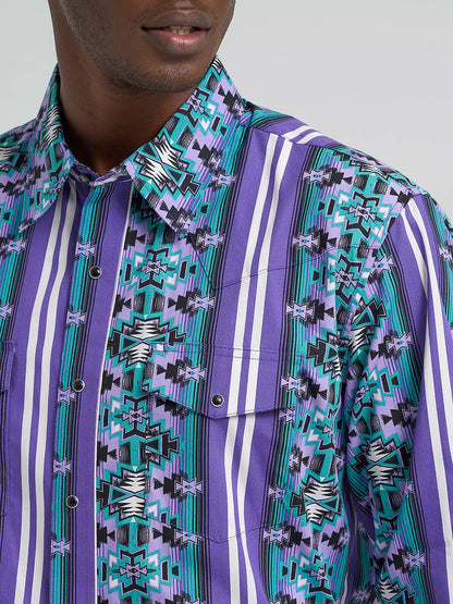 Man wearing a purple and turquoise geometric western shirt with snap buttons