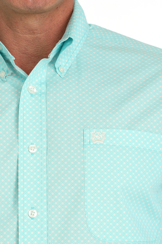 Light blue button-up shirt with subtle geometric pattern and chest pocket embroidery