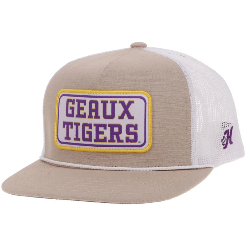 A beige and white trucker hat with a purple and gold 'GEAUX TIGERS' patch on the front, featuring a purple 'H' logo on the side mesh.