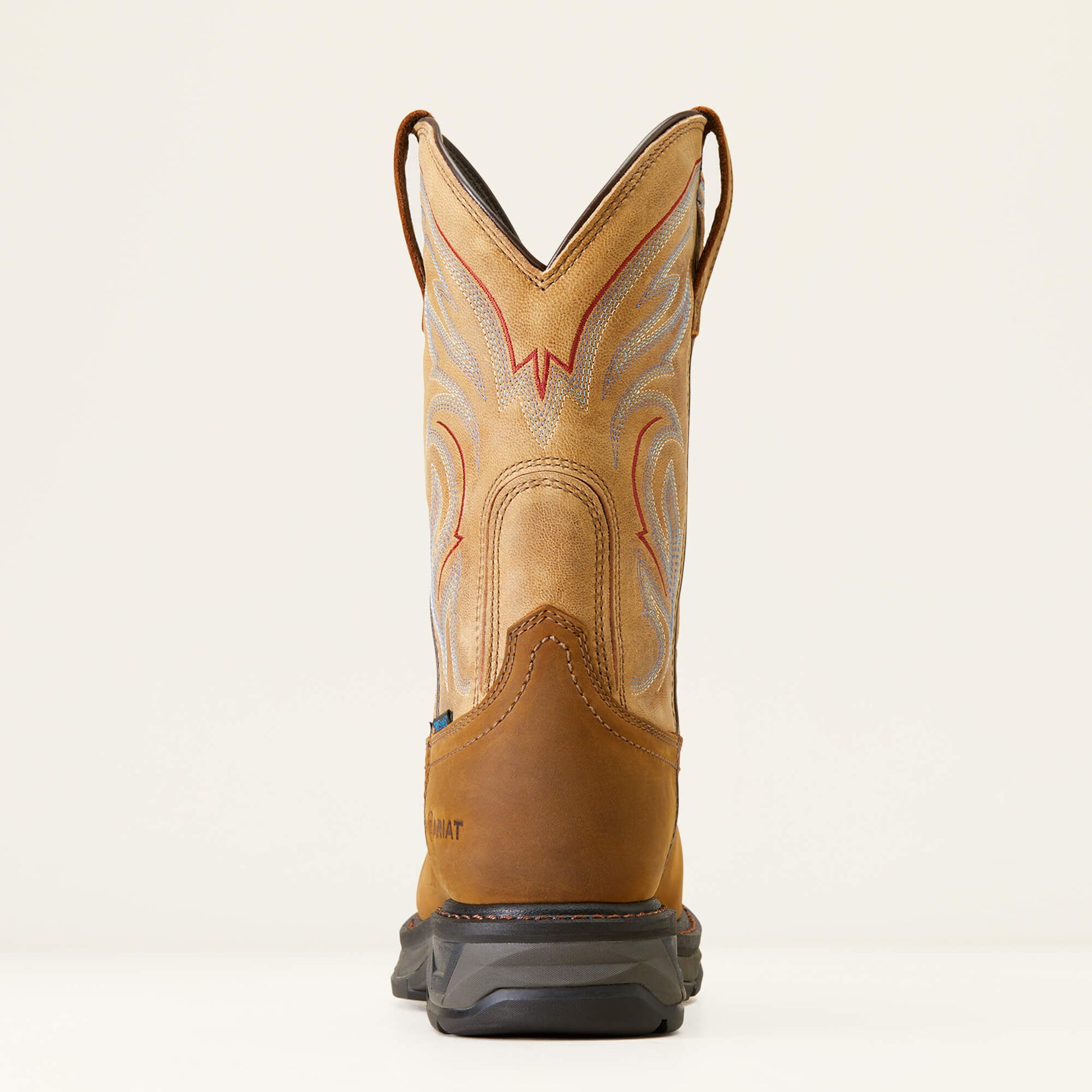 Tan cowboy boot with decorative patterns on a beige background