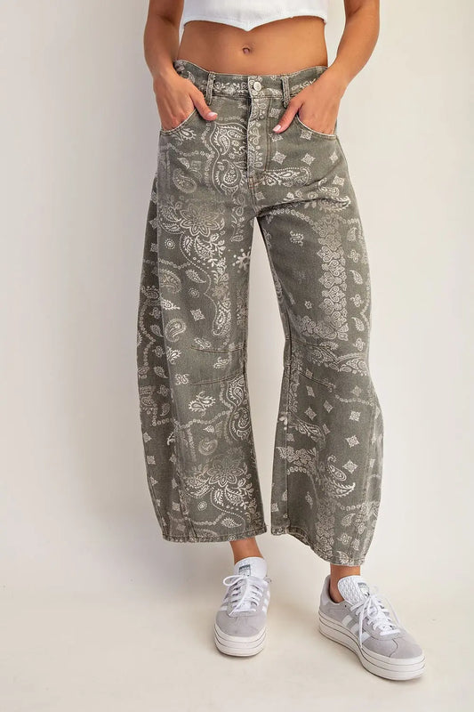 front and back pockets, and visible seam paneling through the legs, finished with belt loops and a button closure