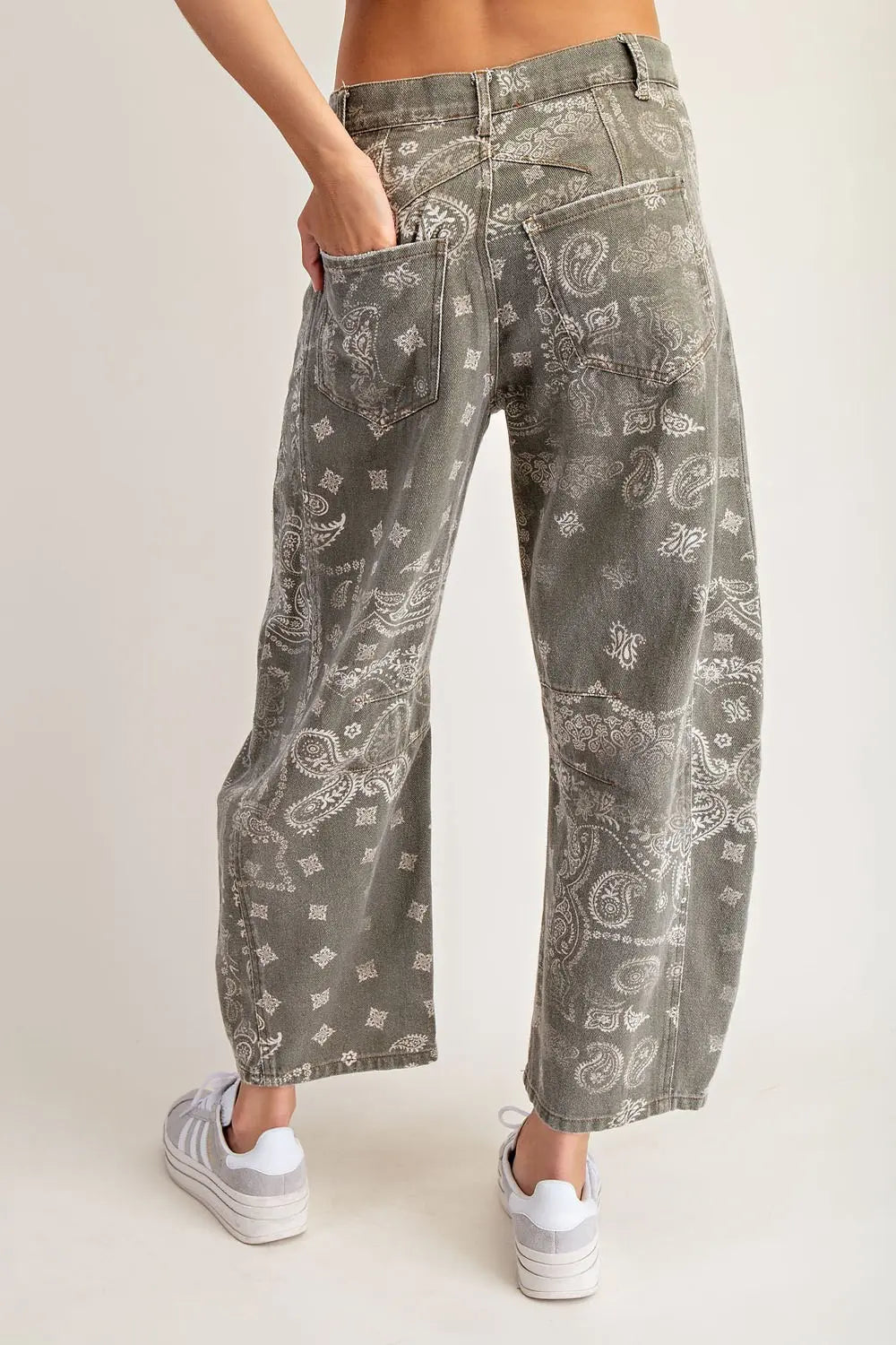  front and back pockets, and visible seam paneling through the legs, finished with belt loops and a button closure