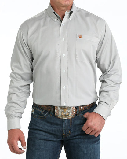 Men's light gray western button-up shirt with chest pocket, blue jeans, and tooled belt buckle
