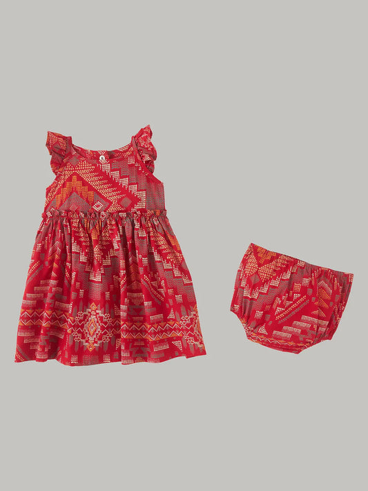 Red baby dress and matching diaper cover with geometric print on light gray background