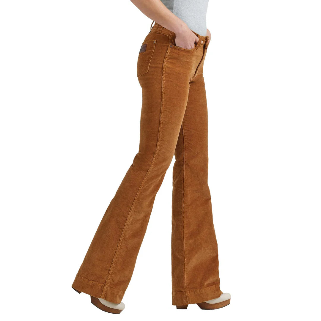 Woman wearing brown corduroy flared pants with side pockets and block heel shoes