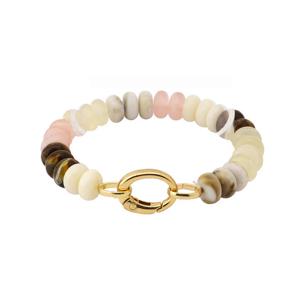 Beaded bracelet with pink, cream, and brown stones and a gold-tone clasp on white background