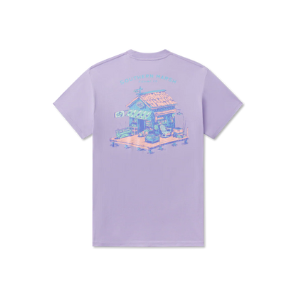 Lavender t-shirt with a graphic of a small house on a white background