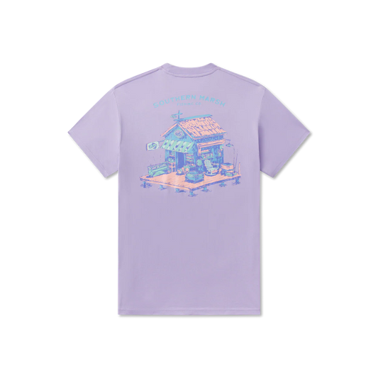 Lavender t-shirt with a graphic of a small house on a white background