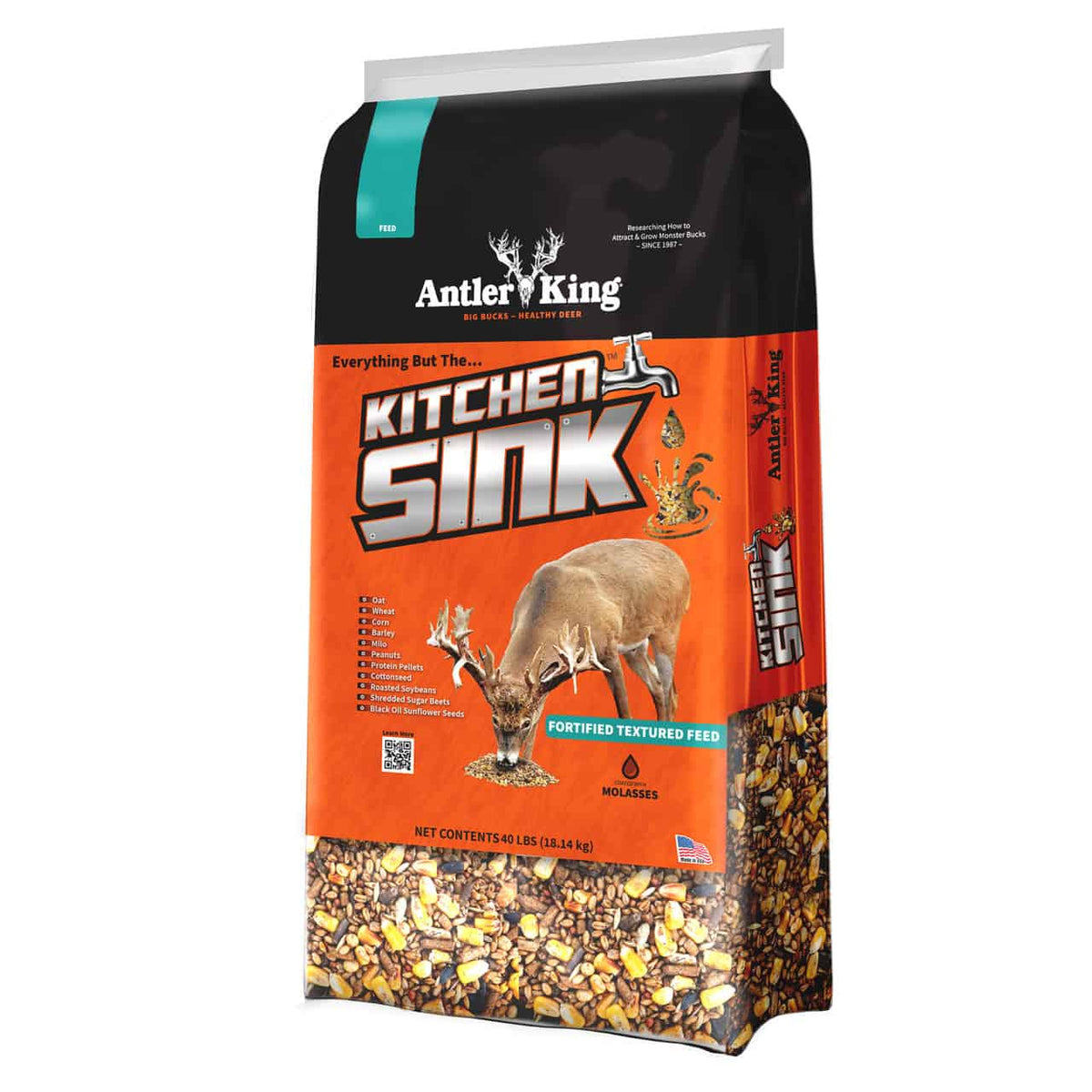 A 15.4 lb bag of Antler King Kitchen Sink Fortified Textured Feed, featuring a black and orange design with a graphic of a deer and a clear window at the bottom showing the textured feed inside.