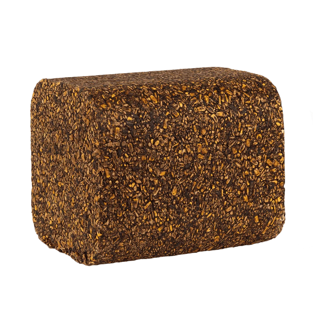 A rectangular, thick-walled cushion or foam block with rounded corners, covered in a dense, textured pattern of dark brown and golden-brown flecks, isolated on a solid white background.