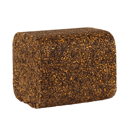 A rectangular, thick-walled cushion or foam block with rounded corners, covered in a dense, textured pattern of dark brown and golden-brown flecks, isolated on a solid white background.