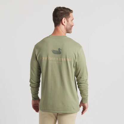 Man wearing olive green long sleeve shirt with duck logo and Southern Marsh text on back