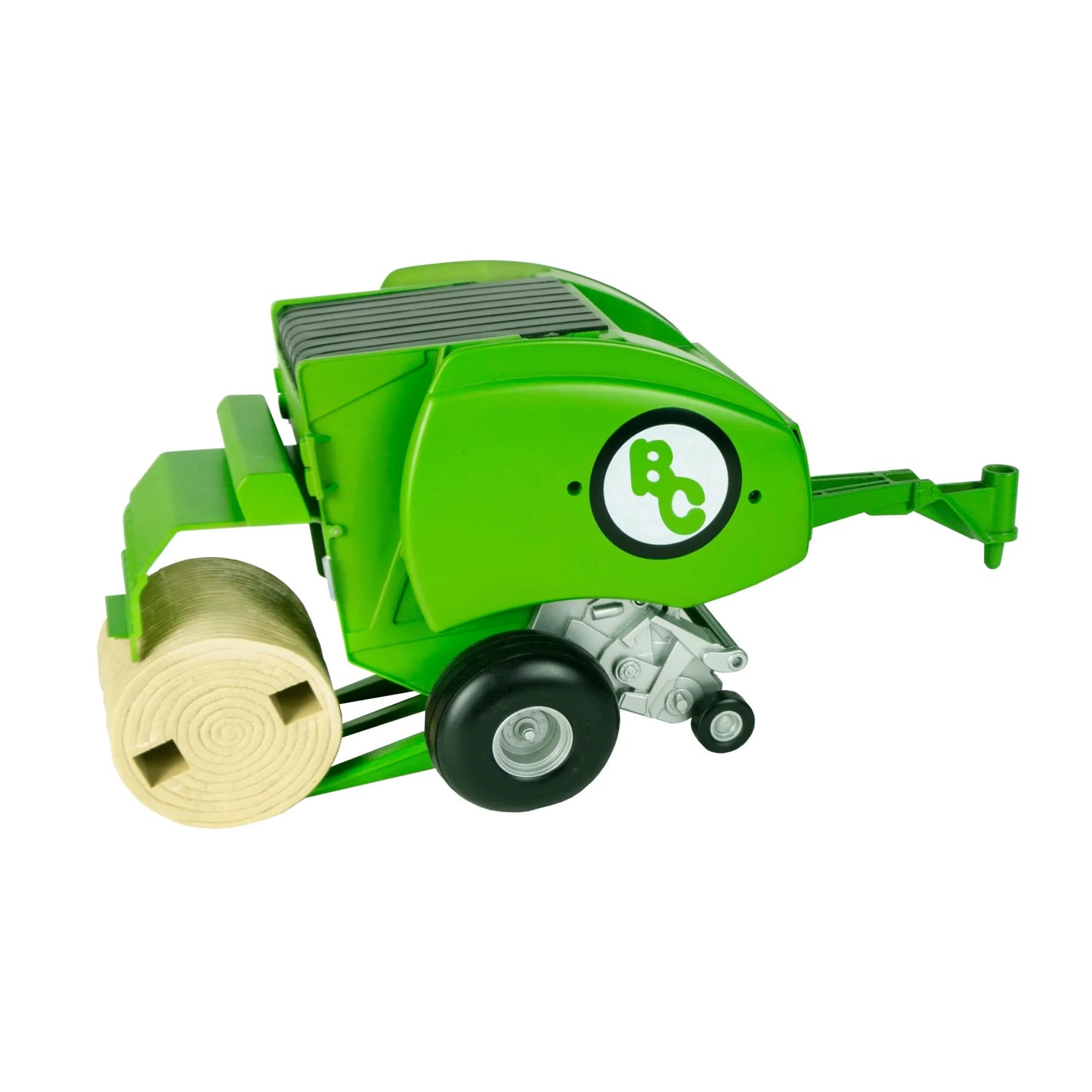 Green toy baler with black wheels and a round hay bale attachment on white background