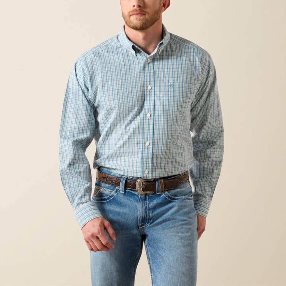 Man wearing light blue plaid long sleeve button-down shirt and blue jeans