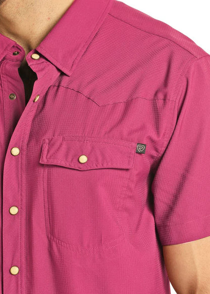 Close-up of a magenta shirt with button details on a white background