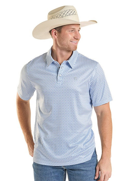 Man wearing a blue patterned shirt and beige cowboy hat on a white background