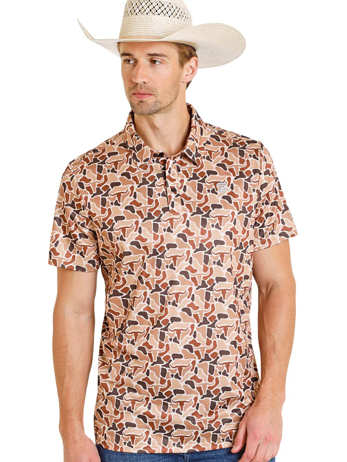 Man wearing a patterned shirt and cowboy hat on a white background