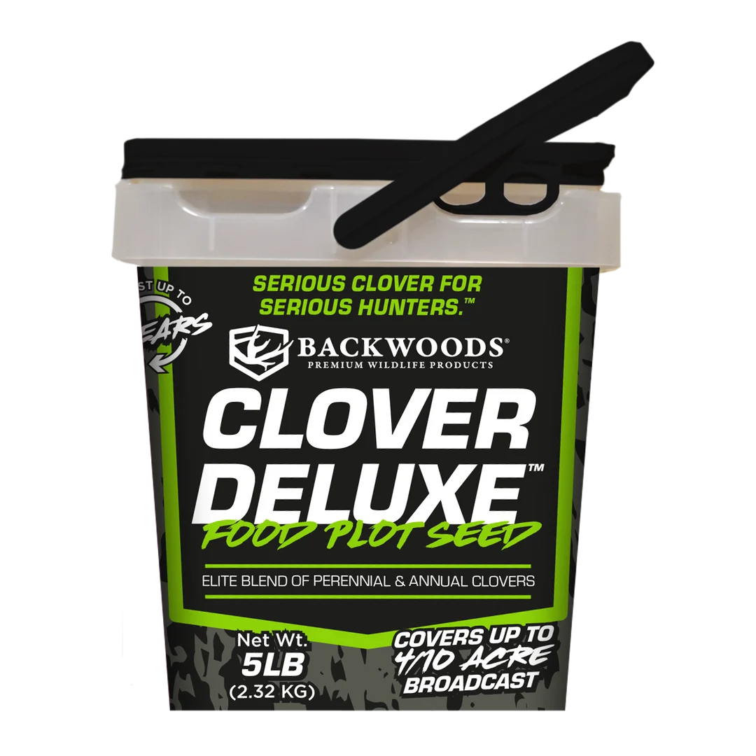A 5 lb bucket of Backwoods Clover Deluxe Food Plot Seed, featuring a black and green label with a black scoop resting on the lid, set against a plain white background.