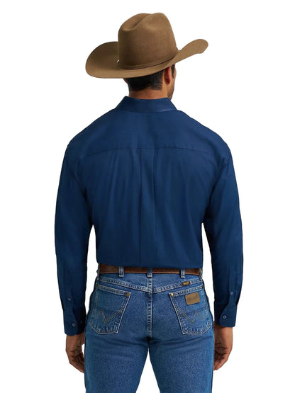 Man wearing a brown cowboy hat, blue button-down shirt, and blue jeans, shown from the back