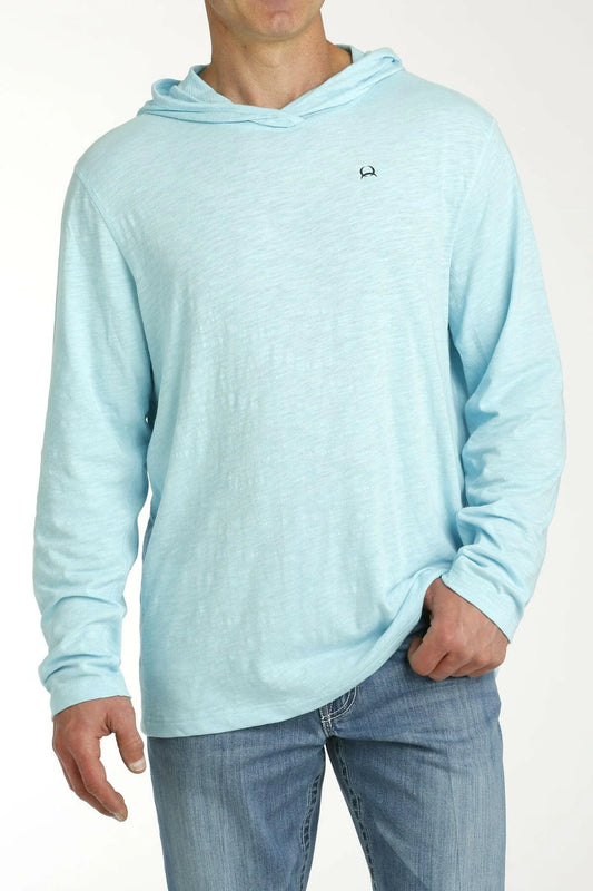 Light blue hoodie worn by a person on a white background