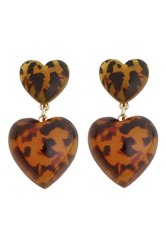 Tortoiseshell heart-shaped earrings on a white background