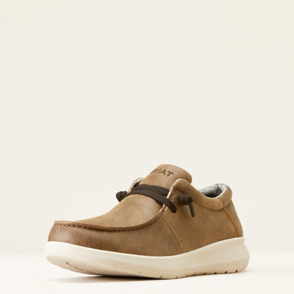 Brown casual slip-on shoe with white sole and black laces, displayed on a plain background.