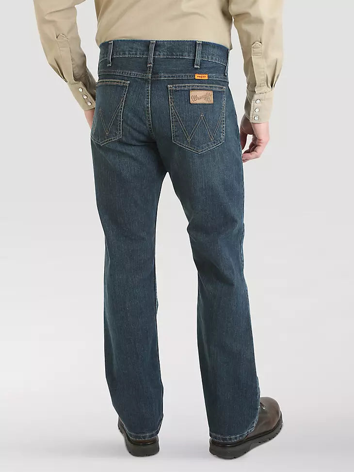 Man wearing classic blue jeans and brown boots, shown from the back, on light background