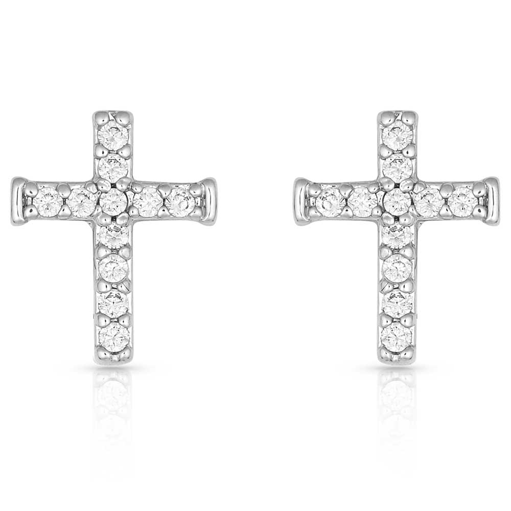 Pair of silver cross earrings with clear gemstones on a white background