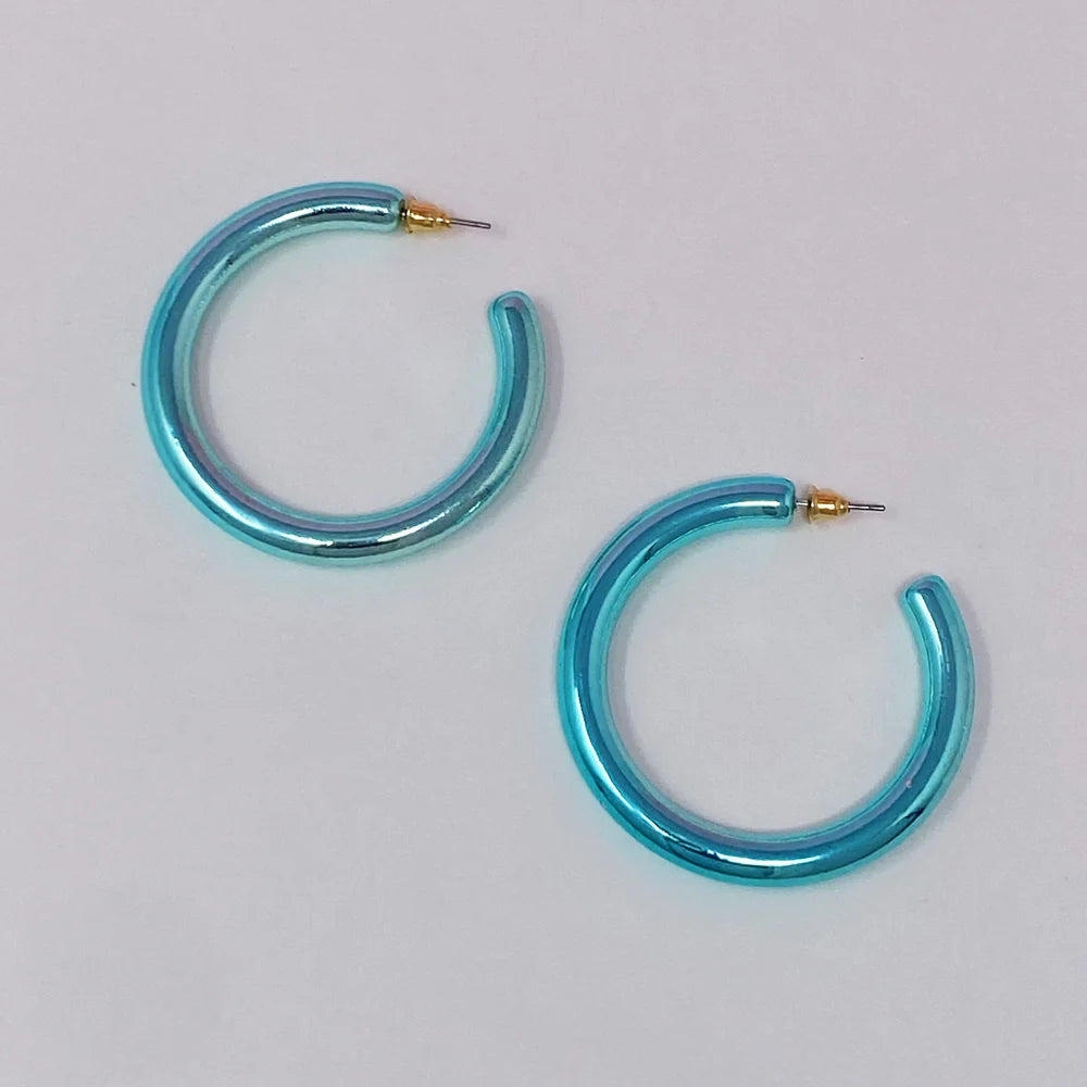Pair of shiny turquoise hoop earrings with gold posts on a white background