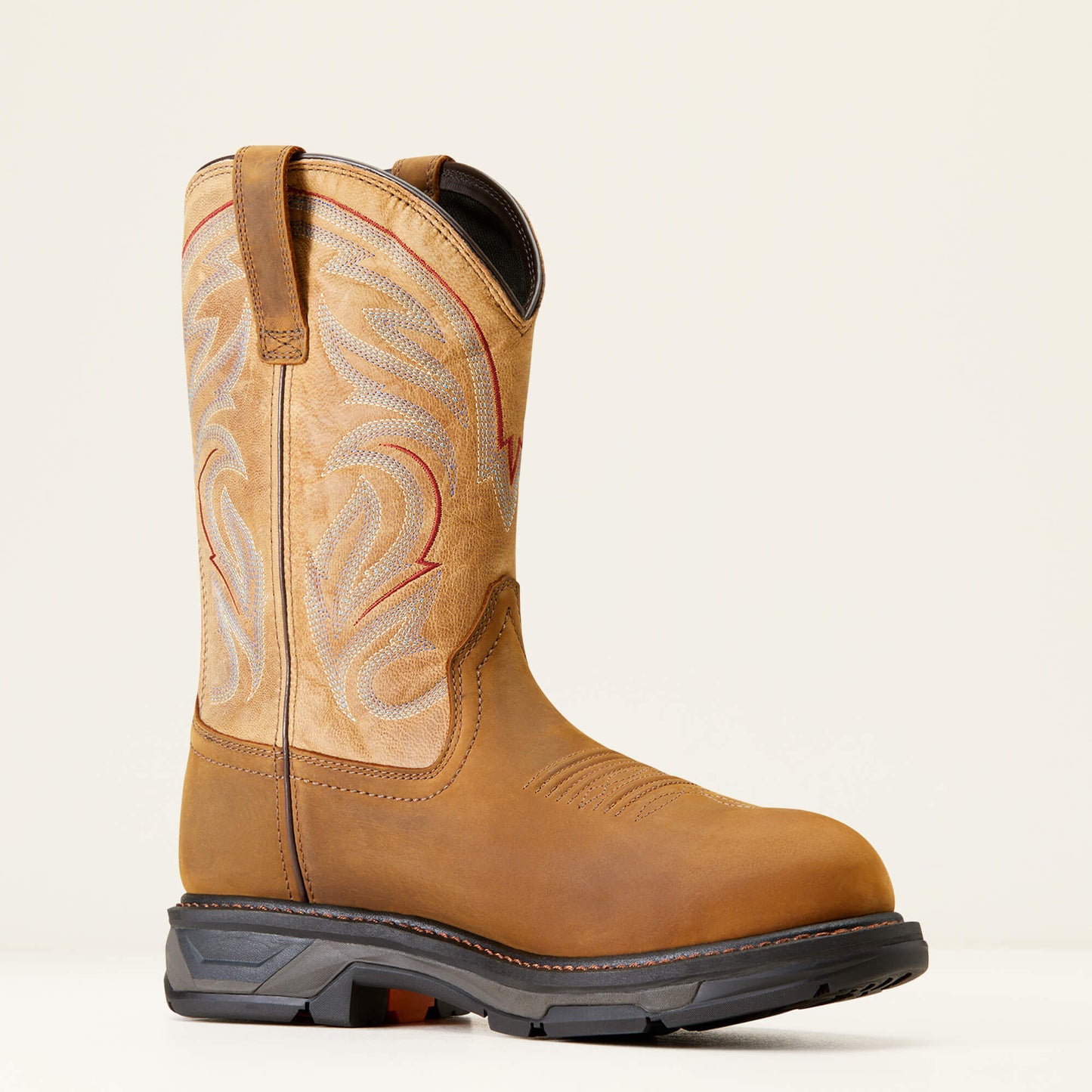 Brown cowboy boot with intricate stitching on a beige background