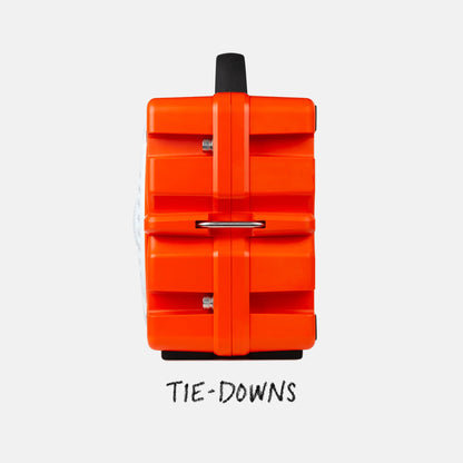 Orange suitcase with tie-downs on a white background
