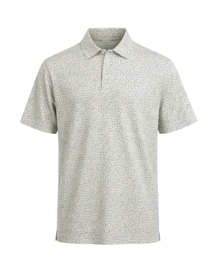 A short-sleeve polo shirt with a fine micro-pattern of small dark spots on a light sage green background, displayed on a clean white background.