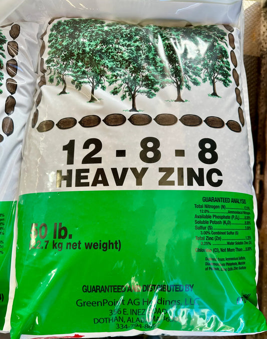 Fertilizer bag with '12-8-8 Heavy Zinc' label on a white background