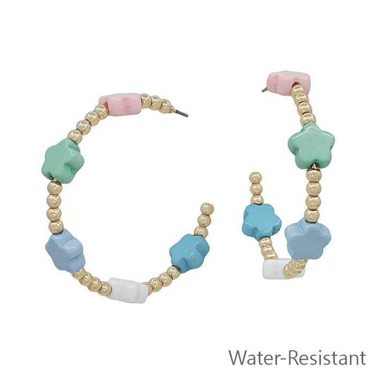 Colorful beaded bracelet with star-shaped beads on a white background