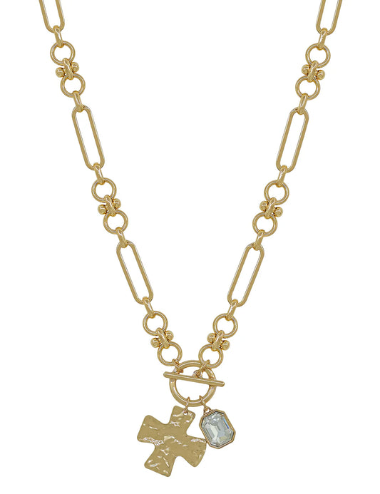 Gold chain necklace with hammered cross pendant and clear gemstone charm