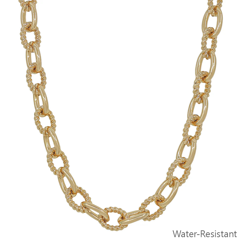 Gold chain necklace on a white background